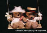 BearCoupleOnSwing.jpg (13218 bytes)